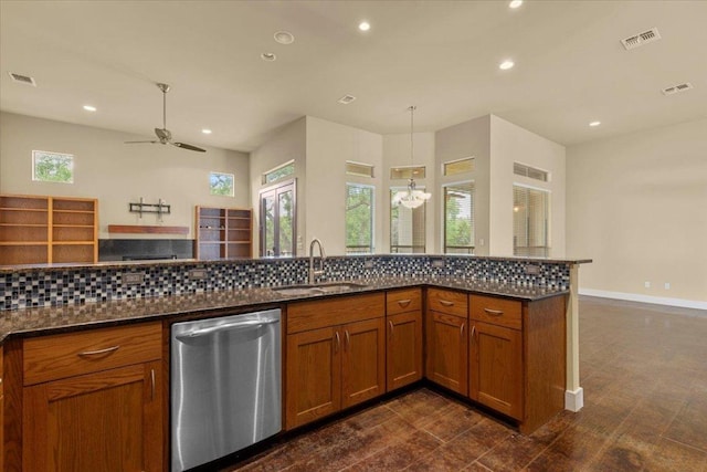 kitchen featuring dishwasher, a sink, brown cabinetry, recessed lighting, and ceiling fan