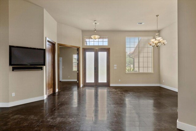 2450 Great Oaks Dr, San Marcos, TX 78666 - foyer entrance featuring baseboards and a chandelier