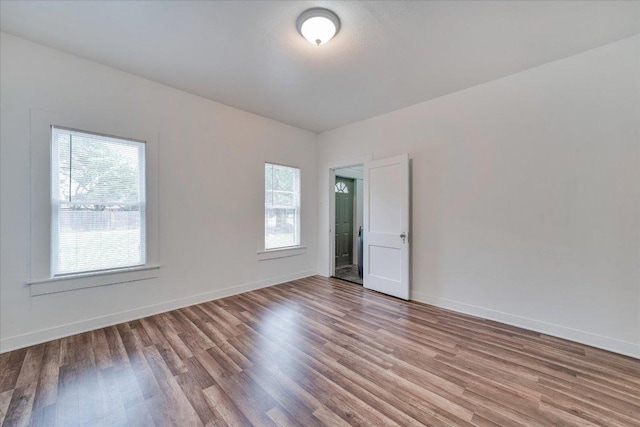 513 San Marcos Hwy, Luling, TX 78648 - empty room with wood finished floors