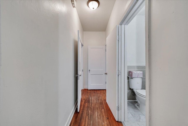 hallway with wood finished floors
