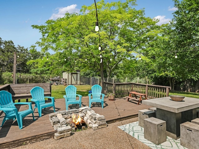6802 Rio Bravo Ln, Austin, TX 78737 - wooden deck featuring an outdoor fire pit and view of wooded area