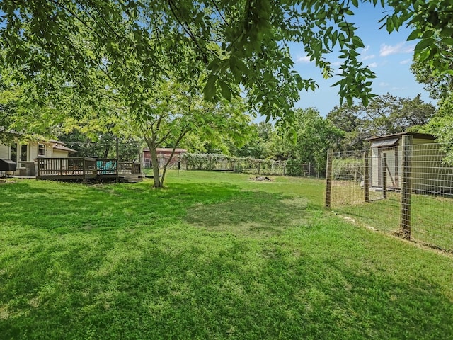 6802 Rio Bravo Ln, Austin, TX 78737 - view of yard featuring a wooden deck and an outbuilding