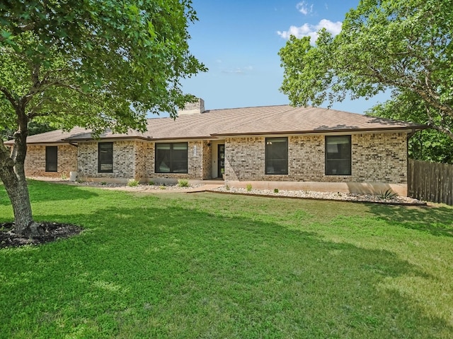 6802 Rio Bravo Ln, Austin, TX 78737 - ranch-style home with brick siding, a chimney, and a shingled roof