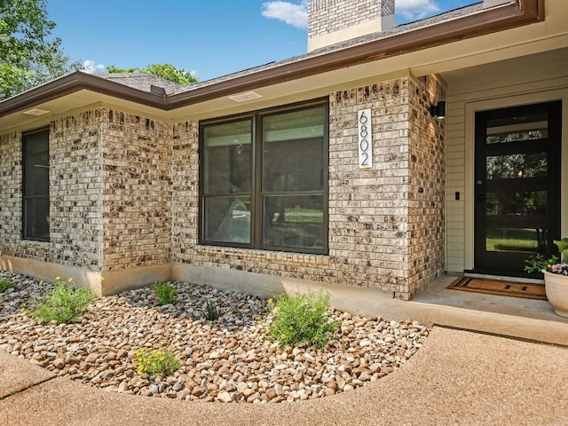 6802 Rio Bravo Ln, Austin, TX 78737 - entrance to property with brick siding and a chimney