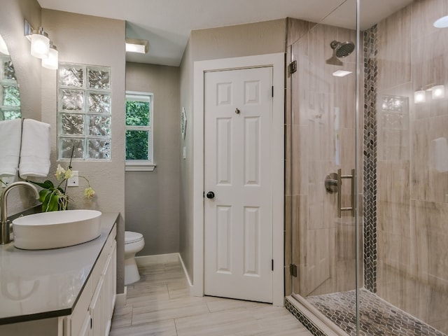 6802 Rio Bravo Ln, Austin, TX 78737 - full bath with vanity, a shower stall, toilet, and baseboards