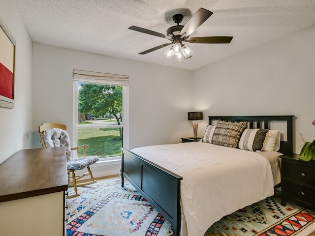 6802 Rio Bravo Ln, Austin, TX 78737 - bedroom featuring a textured ceiling and ceiling fan