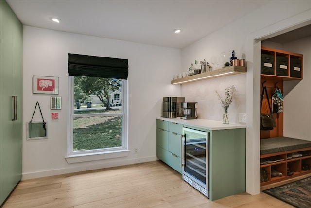 6802 Rio Bravo Ln, Austin, TX 78737 - indoor dry bar featuring beverage cooler, light wood-style floors, baseboards, and recessed lighting