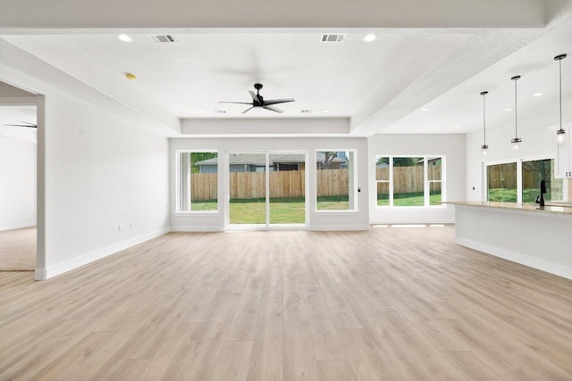 20405 Sunset Strip St, Lago Vista, TX 78645 - unfurnished living room with a ceiling fan, light wood-type flooring, and recessed lighting