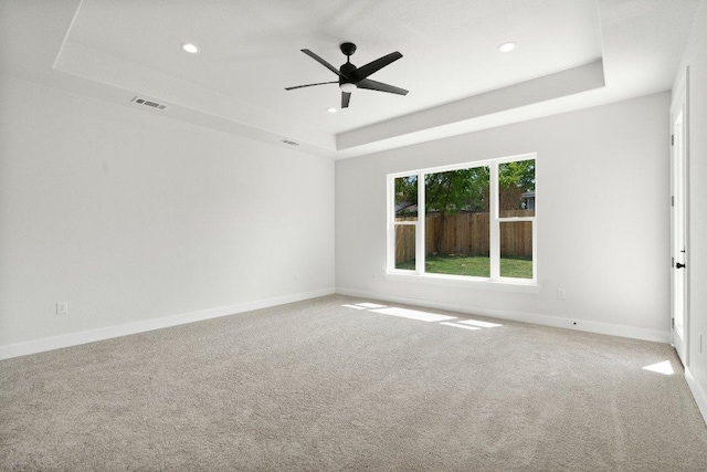 20405 Sunset Strip St, Lago Vista, TX 78645 - carpeted empty room with a tray ceiling, recessed lighting, and a ceiling fan