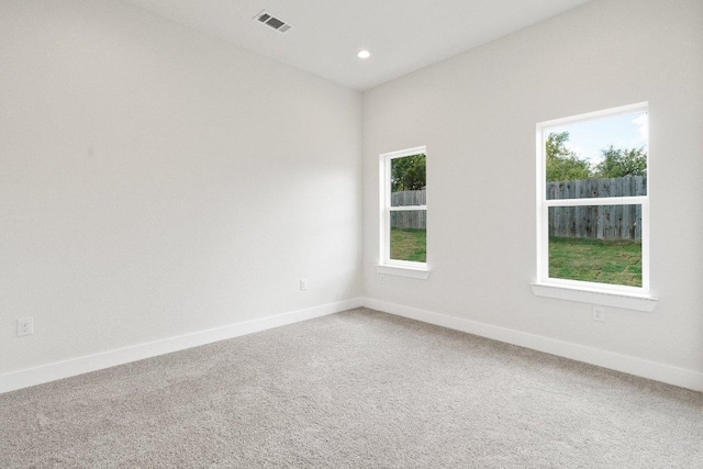 20405 Sunset Strip St, Lago Vista, TX 78645 - carpeted empty room with baseboards and recessed lighting