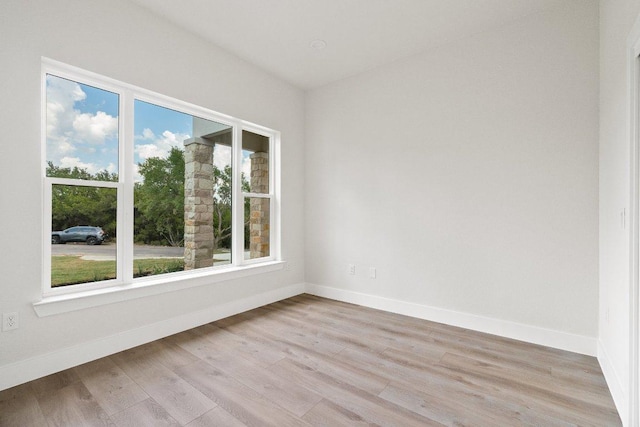 20405 Sunset Strip St, Lago Vista, TX 78645 - unfurnished room with light wood finished floors and baseboards