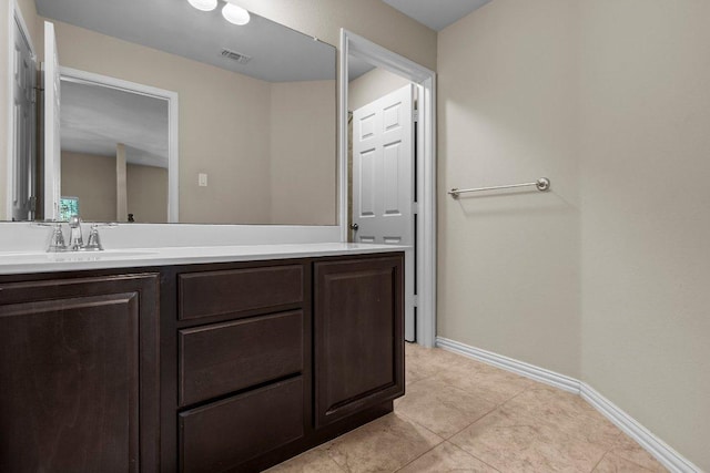 2020 Elaina Loop, Leander, TX 78641 - bathroom with vanity, baseboards, and tile patterned flooring