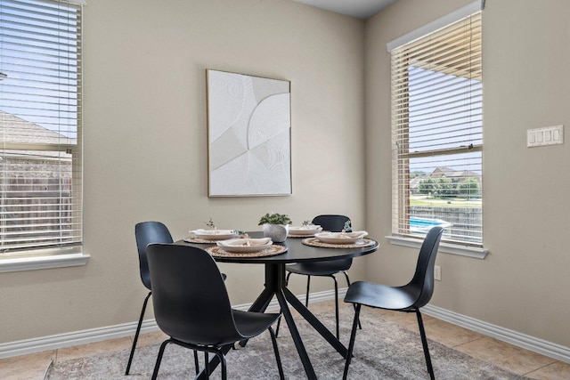 2020 Elaina Loop, Leander, TX 78641 - dining area with tile patterned floors and baseboards