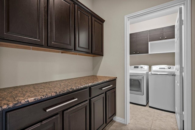 2020 Elaina Loop, Leander, TX 78641 - laundry room featuring washing machine and dryer, light tile patterned floors, cabinet space, and baseboards