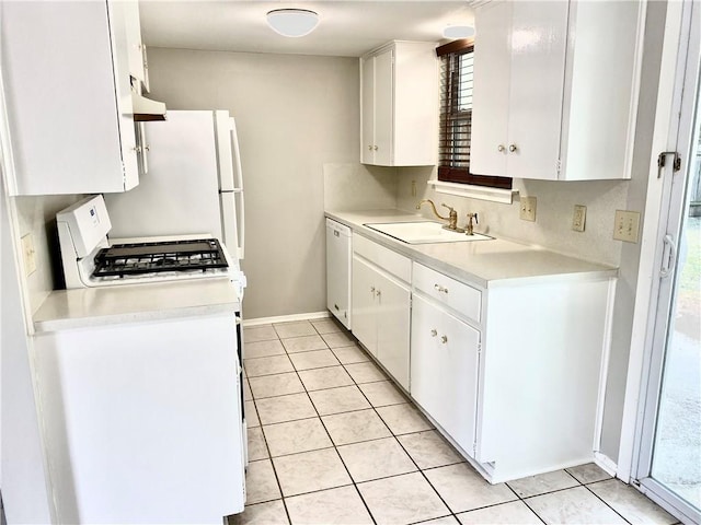 8502 Woodstone Dr, Austin, TX 78757 - kitchen with white appliances, a sink, light countertops, white cabinetry, and light tile patterned floors