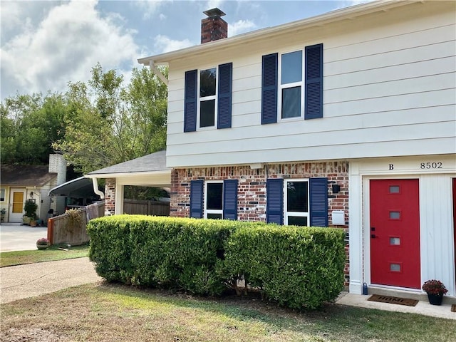 8502 Woodstone Dr, Austin, TX 78757 - view of front of property featuring a chimney
