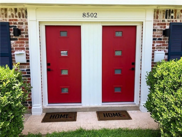 8502 Woodstone Dr, Austin, TX 78757 - view of exterior entry featuring brick siding