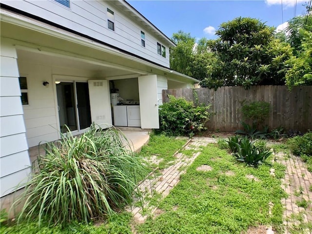 8502 Woodstone Dr, Austin, TX 78757 - view of yard with washer and dryer and fence