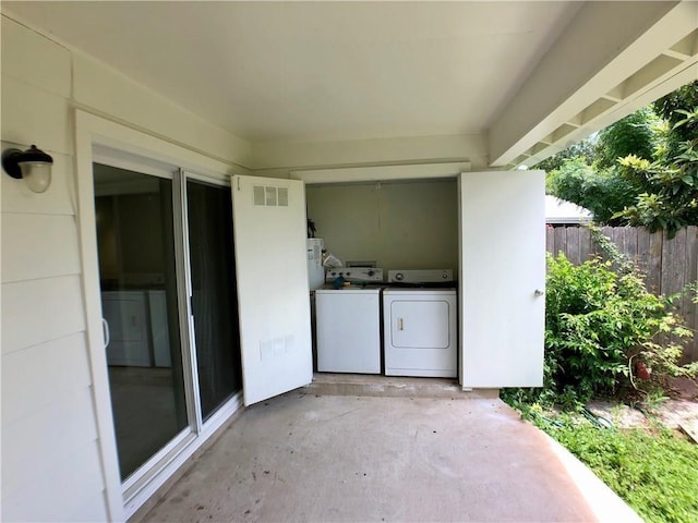 8502 Woodstone Dr, Austin, TX 78757 - view of patio with independent washer and dryer and fence