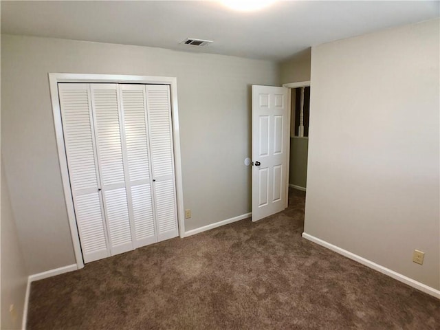 8502 Woodstone Dr, Austin, TX 78757 - unfurnished bedroom with carpet flooring, a closet, and baseboards