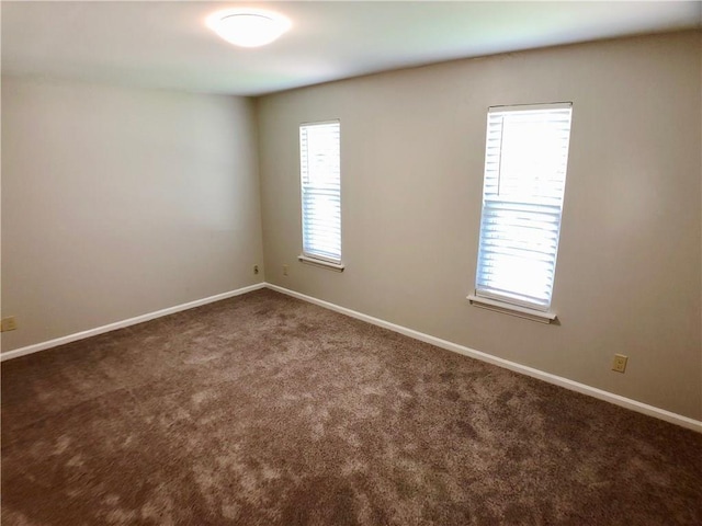 8502 Woodstone Dr, Austin, TX 78757 - spare room featuring carpet flooring and baseboards
