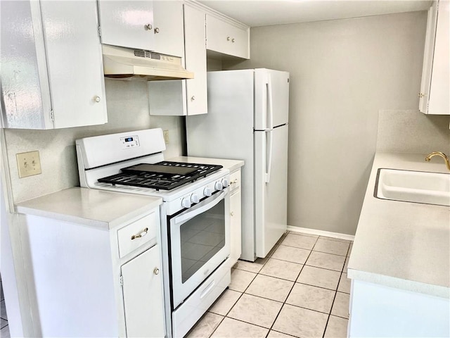8502 Woodstone Dr, Austin, TX 78757 - kitchen with white appliances, under cabinet range hood, a sink, light countertops, and light tile patterned flooring