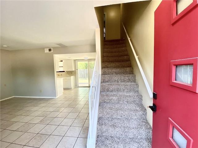 8502 Woodstone Dr, Austin, TX 78757 - stairs with tile patterned flooring and baseboards