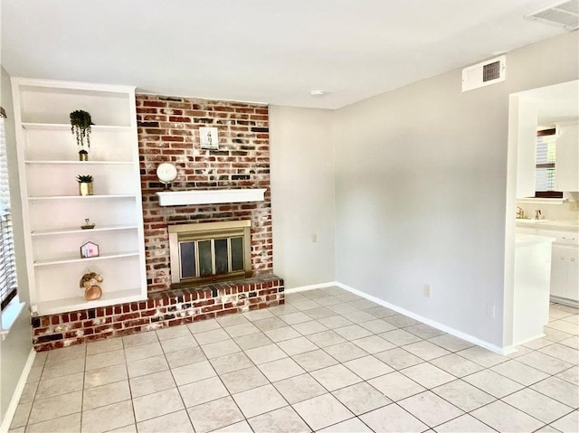 8502 Woodstone Dr, Austin, TX 78757 - unfurnished living room with healthy amount of natural light and light tile patterned floors