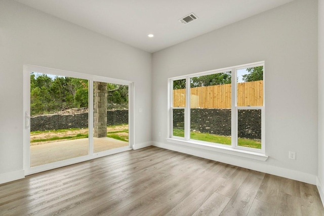 8800 Bar K Ranch Rd, Lago Vista, TX 78645 - unfurnished room with baseboards, wood finished floors, and recessed lighting