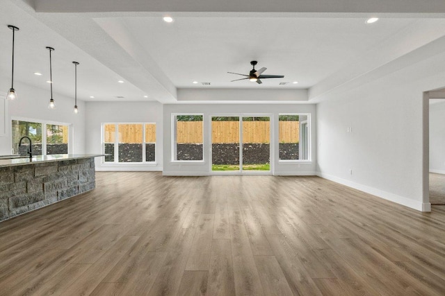 8800 Bar K Ranch Rd, Lago Vista, TX 78645 - unfurnished living room featuring ceiling fan, wood finished floors, and recessed lighting