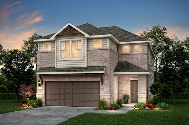 view of front of home with a front yard, a garage, concrete driveway, and a shingled roof