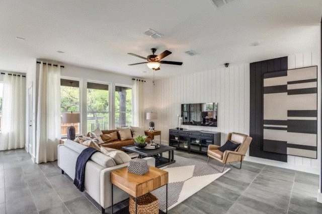 living area with ceiling fan
