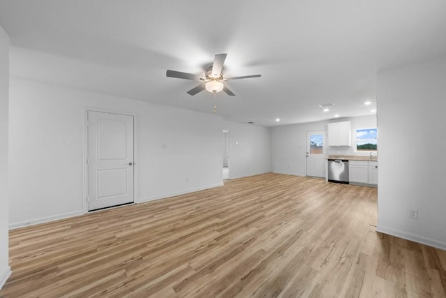 unfurnished living room featuring ceiling fan, light wood-style floors, recessed lighting, and baseboards