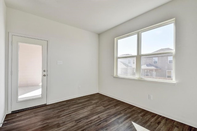 1174 Amy Dr, Kyle, TX 78640 - spare room featuring dark wood-type flooring and baseboards