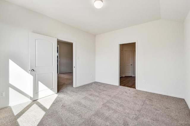 1174 Amy Dr, Kyle, TX 78640 - empty room with carpet, vaulted ceiling, and baseboards