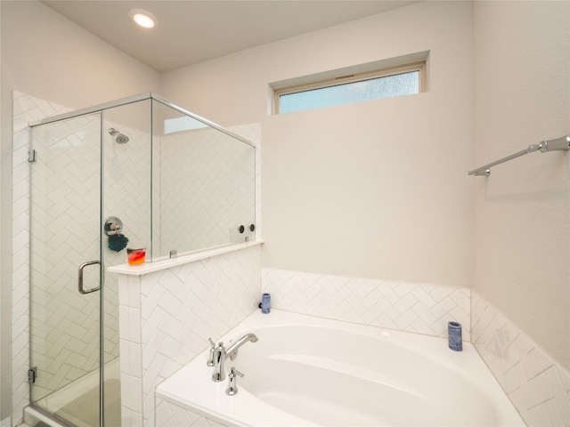 111 Lyrebird Ln, Hutto, TX 78634 - full bath featuring a stall shower, a bath, and recessed lighting