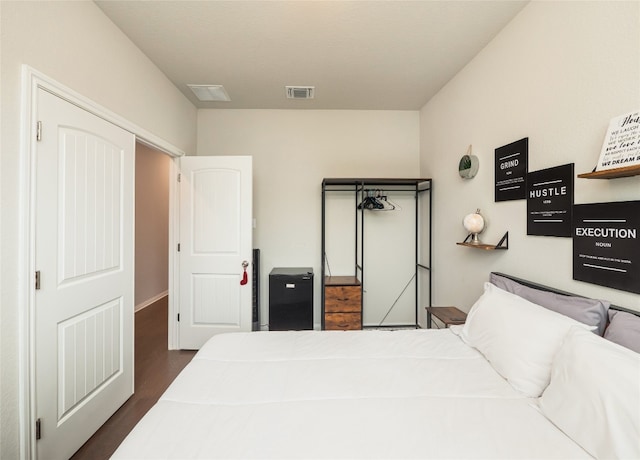 111 Lyrebird Ln, Hutto, TX 78634 - bedroom featuring dark wood-style flooring and baseboards