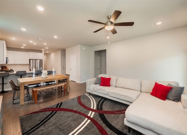111 Lyrebird Ln, Hutto, TX 78634 - living area featuring ceiling fan, dark wood-type flooring, recessed lighting, and baseboards
