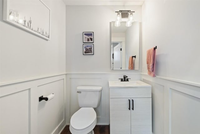 4423 Jinx Ave Unit 2, Austin, TX 78745 - half bath featuring a decorative wall, vanity, and a wainscoted wall
