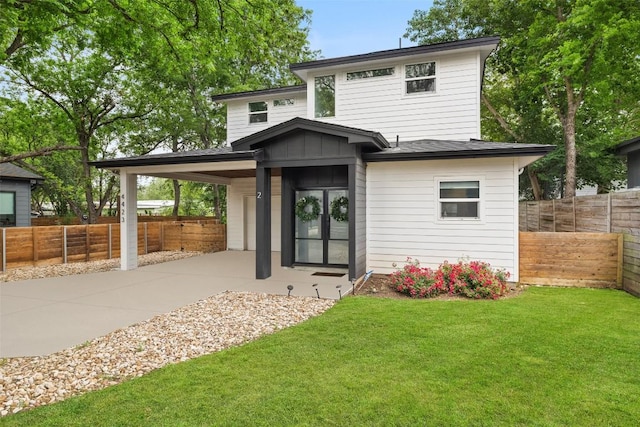 4423 Jinx Ave Unit 2, Austin, TX 78745 - view of front of house with concrete driveway and board and batten siding