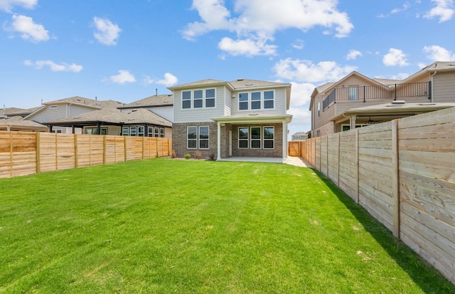 back of house with a patio