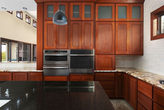 9208 Madrone Ranch Trl, Austin, TX 78738 - kitchen featuring a warming drawer, backsplash, and brown cabinets
