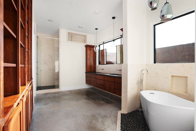 9208 Madrone Ranch Trl, Austin, TX 78738 - full bath featuring a shower stall, a freestanding tub, concrete floors, and vanity