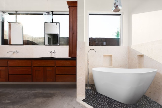 9208 Madrone Ranch Trl, Austin, TX 78738 - full bathroom featuring vanity, a soaking tub, and concrete flooring