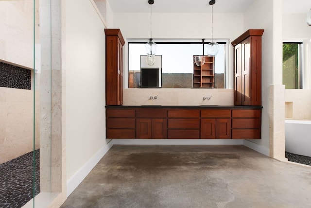 9208 Madrone Ranch Trl, Austin, TX 78738 - bathroom with concrete floors, a soaking tub, and double vanity