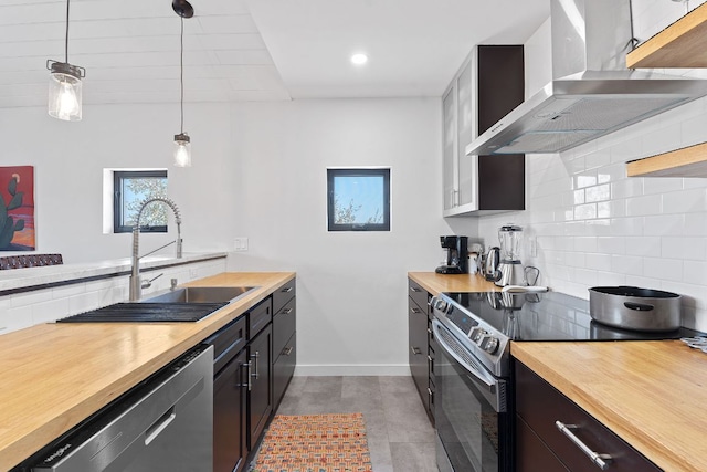 9208 Madrone Ranch Trl, Austin, TX 78738 - kitchen featuring wall chimney exhaust hood, wood counters, dishwasher, black range with electric cooktop, and a sink