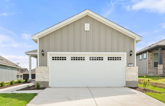 117 Crossbar St, Georgetown, TX 78633 - view of front of property with board and batten siding, concrete driveway, and stone siding