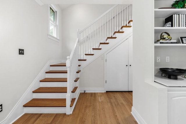 512 E 49th St, Austin, TX 78751 - staircase with wood finished floors and baseboards