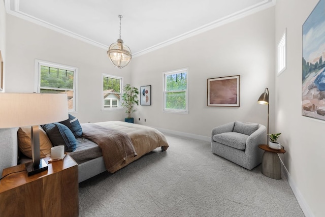 512 E 49th St, Austin, TX 78751 - carpeted bedroom featuring crown molding and a chandelier