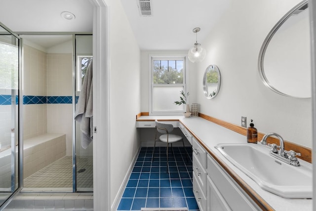 512 E 49th St, Austin, TX 78751 - bathroom featuring tile patterned flooring, vanity, and a shower stall